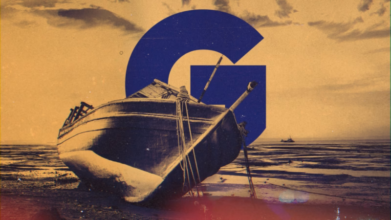 Weathered wooden boat on a tidal shore with a large blue G against a golden sky in the Night Show title sequence.