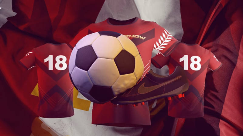 Football and boot in front of red Al-Derby Show shirts bearing number 18 against folded fabric.
