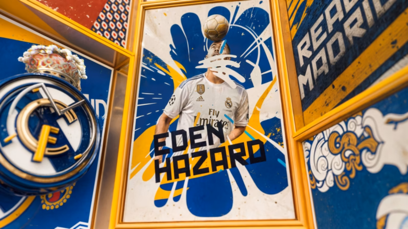 Framed Eden Hazard name and football artwork beside the Real Madrid crest in the One Two television graphics.