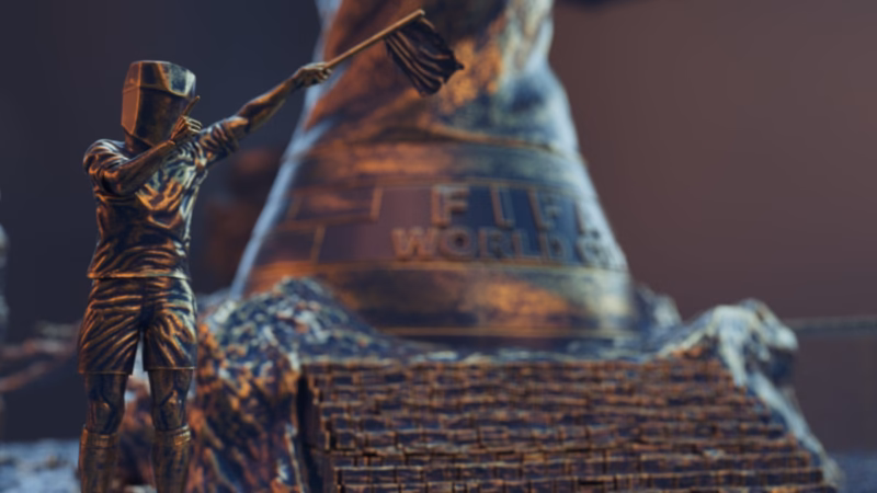 Faceted bronze assistant referee raising a flag in front of the World Cup trophy and stone steps