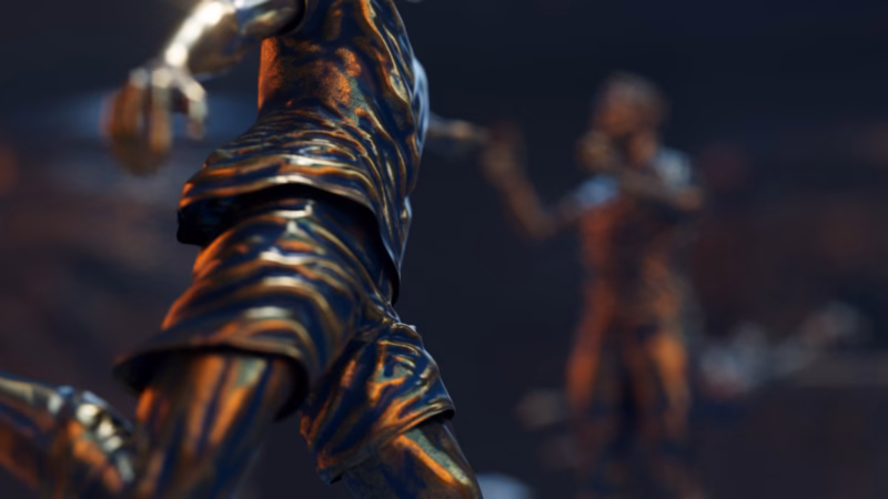 Close-up of a bronze footballer sculpture with other players blurred behind in the Qatar 2022 motion graphics