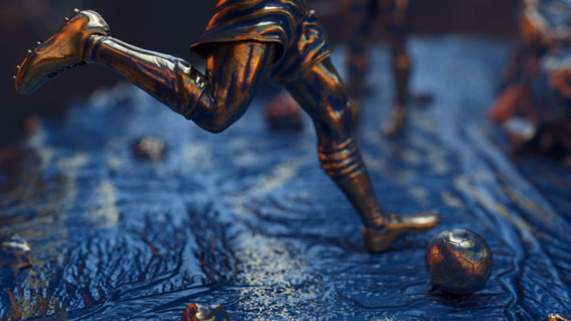 Bronze footballer’s legs poised to strike a ball on a textured blue surface in the Qatar 2022 broadcast artwork