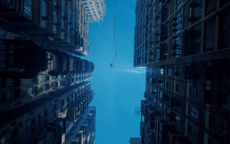 Ecliptica — futuristic towers rising around a blue-lit urban canyon