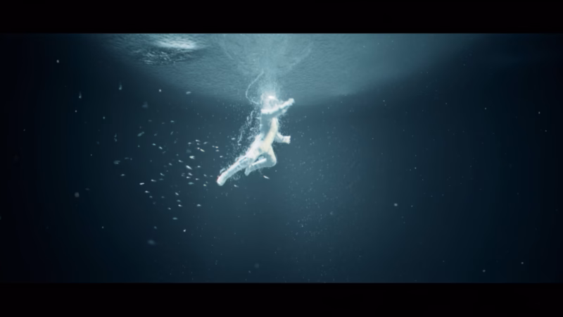 Ecliptica — a solitary figure suspended in a shaft of light